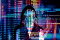 Seorang profesional muda memanfaatkan teknologi cerdas untuk mendukung analisis data pekerjaan harian di sudut kantor modern Jakarta.